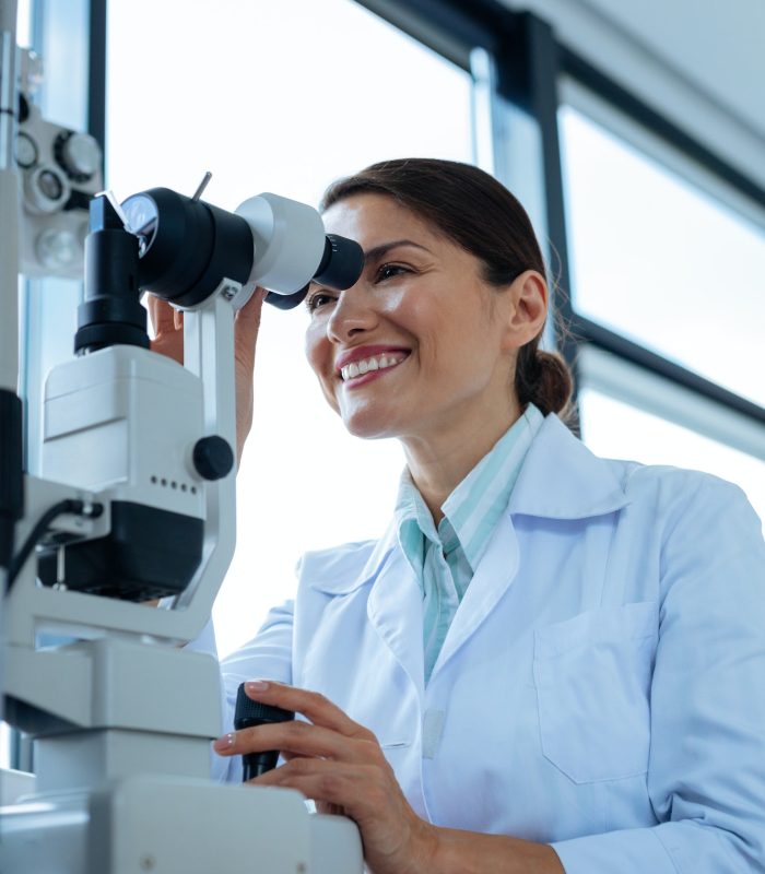 cheerful-female-doctor-looking-into-the-microscope.jpg cheerful-female-doctor-looking-into-the-microscope.jpg